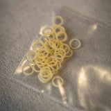Spare Rubber Bands for Flipper coins & Folding coins - (15 per package) - Brown Bear Magic Shop